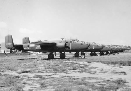 Line-up of No. 18 (NEI) Squadron B-25 Mitchell bombers at Canberra at departure for the Northern Territory .Dutch flag markings and “N5” codes d.