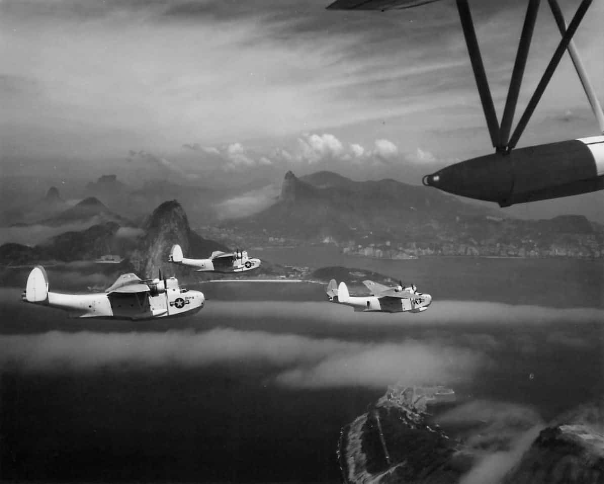 PBM-3S_Martin_Mariners_over_Shoreline_of_Rio_as_they_Return_to_Base